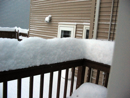 Snow on back railing